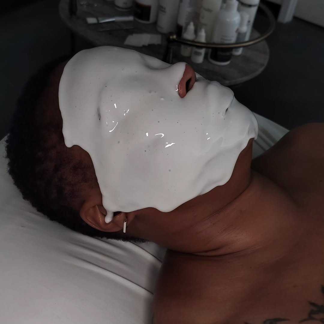 Enzyme mask applied during a facial treatment